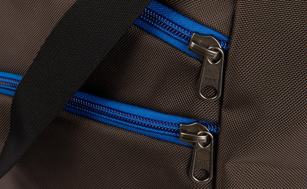 Close shot of the front pocket zippers.
